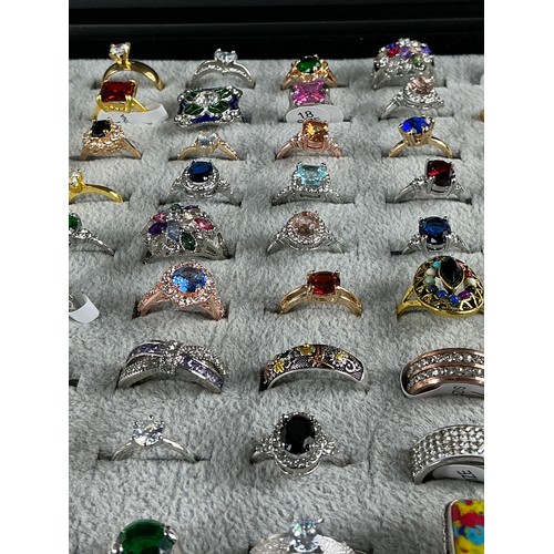47 - Dealers Tray of Dress Rings - 100 rings of various designs and sizes. Gold and Silver tones with a v... 
