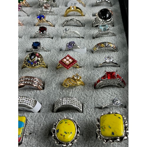 47 - Dealers Tray of Dress Rings - 100 rings of various designs and sizes. Gold and Silver tones with a v... 