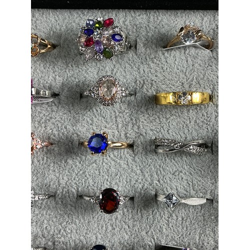 47 - Dealers Tray of Dress Rings - 100 rings of various designs and sizes. Gold and Silver tones with a v... 