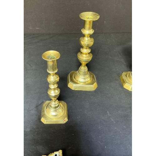 58 - Four Brass Candlesticks - together with toasting forks

Postage band B