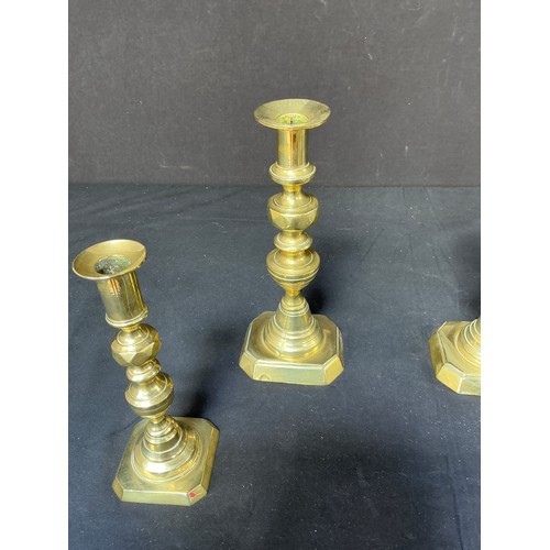 58 - Four Brass Candlesticks - together with toasting forks

Postage band B