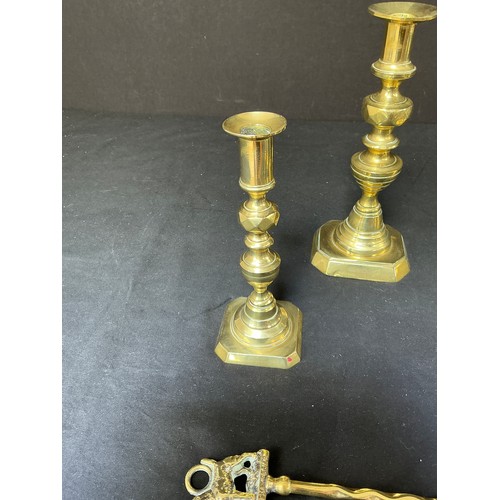 58 - Four Brass Candlesticks - together with toasting forks

Postage band B