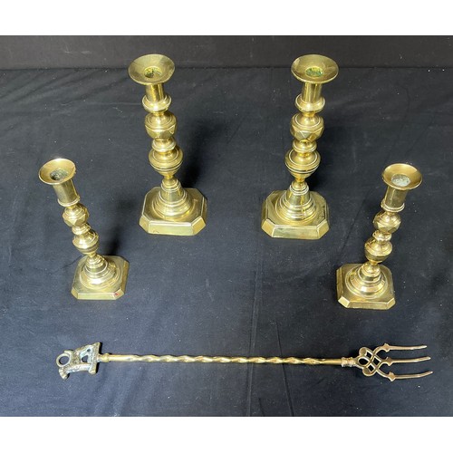 58 - Four Brass Candlesticks - together with toasting forks

Postage band B