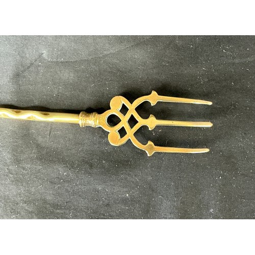 58 - Four Brass Candlesticks - together with toasting forks

Postage band B
