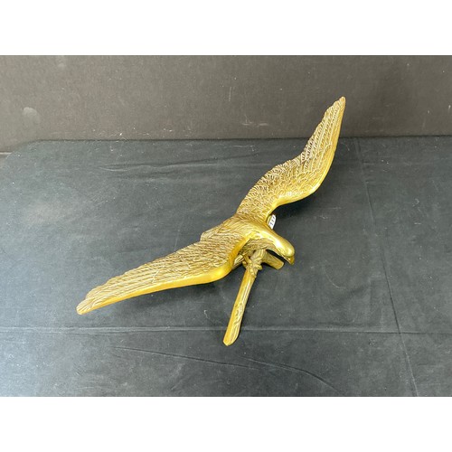 54 - Two Brass Supermarine Ash Trays - together with a large brass eagle

Postage band B