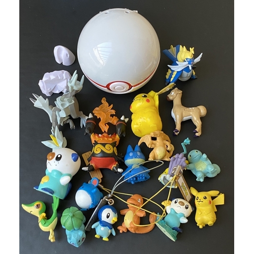 A GROUP OF POKÉMON FIGURES - - A group of assorted Pokemon figures  including Charizard, Pikachu, Nin