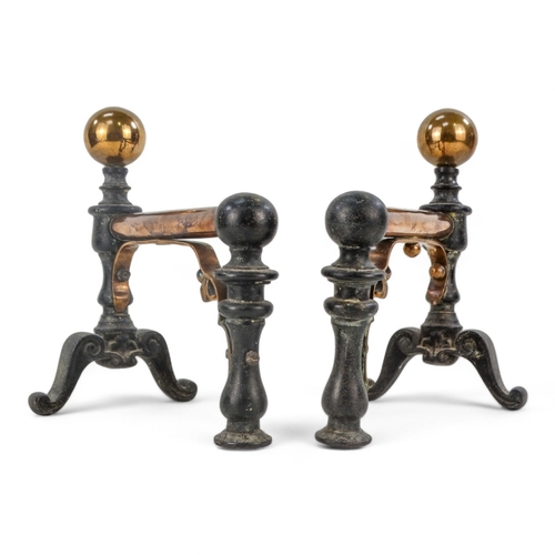 11 - A pair of iron and copper fire dogs - in the decorative arts style with ball finials, 22cm high.