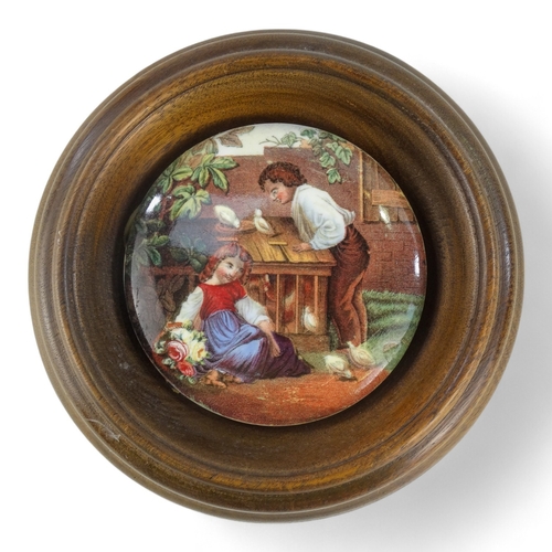 14 - A 19th century Prattware pot lid - view of Pegwell Bay, 10cm diameter, within a wooden frame, togeth... 