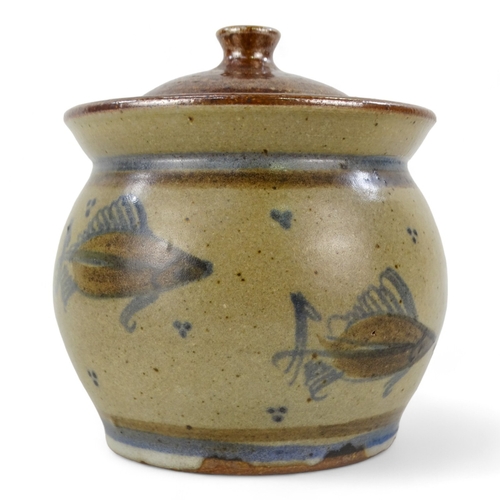 153 - A 20th century British ceramic lidded pot - decorated with fish, incised with initials to base, 11cm... 