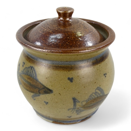 153 - A 20th century British ceramic lidded pot - decorated with fish, incised with initials to base, 11cm... 