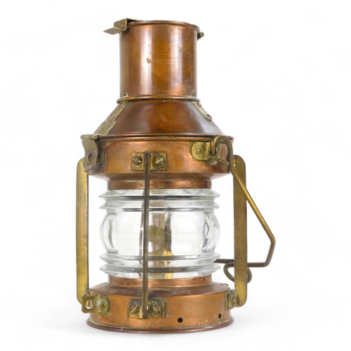 2 - An early 20th century copper and brass mast head lamp - of typical form and including original burne... 