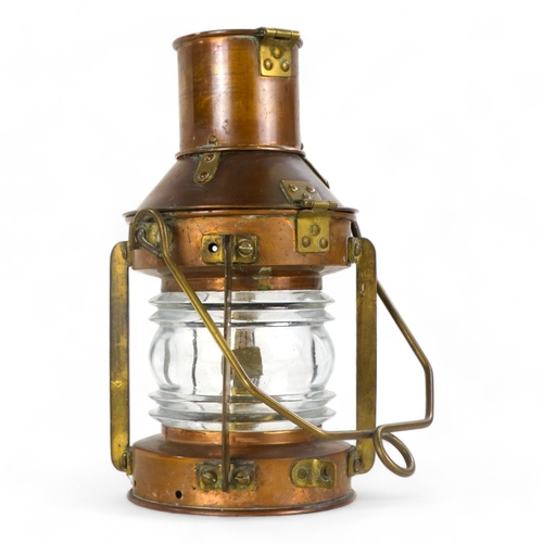 2 - An early 20th century copper and brass mast head lamp - of typical form and including original burne... 