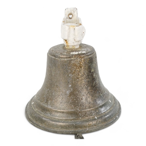 24 - A vintage bronze bell - with a white painted bracket, 18cm high.