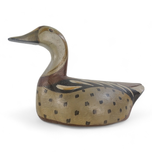 26 - A vintage style decoy duck - polychrome painted in greys and brown, 33cm wide.