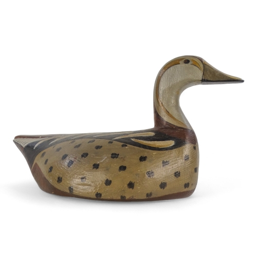 26 - A vintage style decoy duck - polychrome painted in greys and brown, 33cm wide.