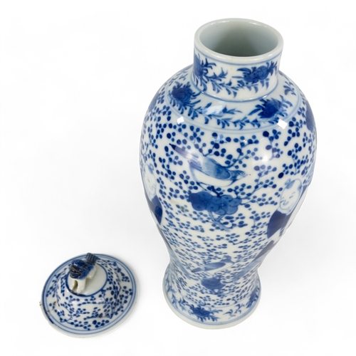 264 - A late 19th century Chinese blue and white vase - lidded and of baluster form and decorated with fig... 