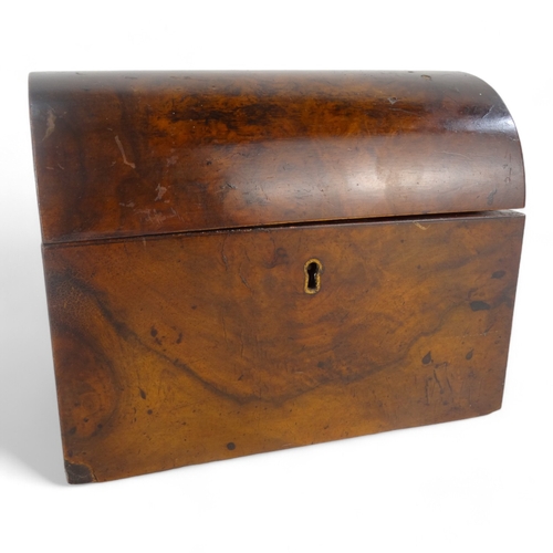 6 - A late 19th century walnut tea caddy - of casket form, the interior with two divisions, 20cm wide.