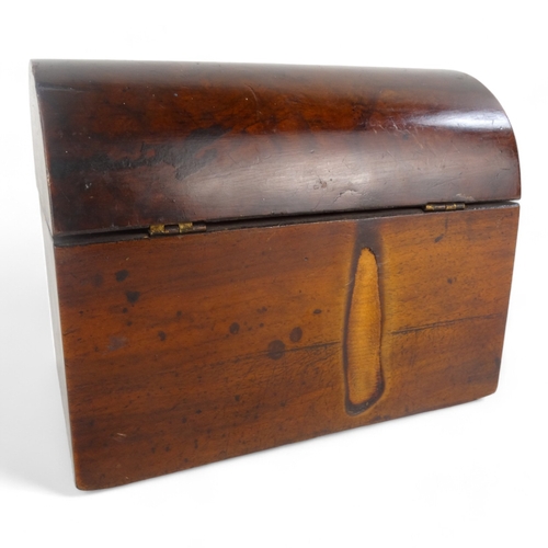 6 - A late 19th century walnut tea caddy - of casket form, the interior with two divisions, 20cm wide.