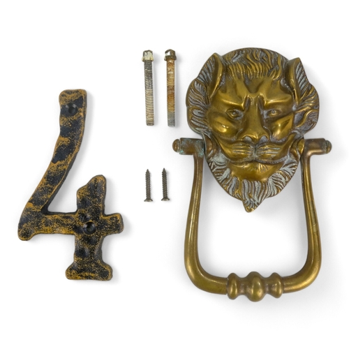 8 - An early 20th century lion mask door knocker - 19cm high, together with a cast number 4. (2)