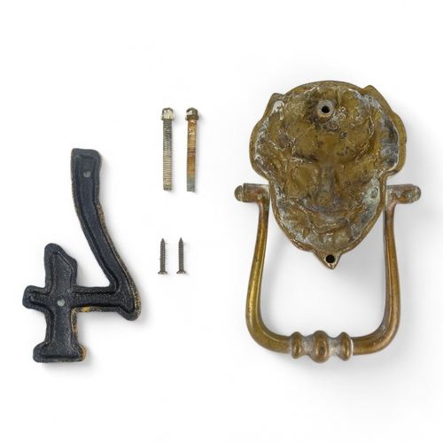 8 - An early 20th century lion mask door knocker - 19cm high, together with a cast number 4. (2)