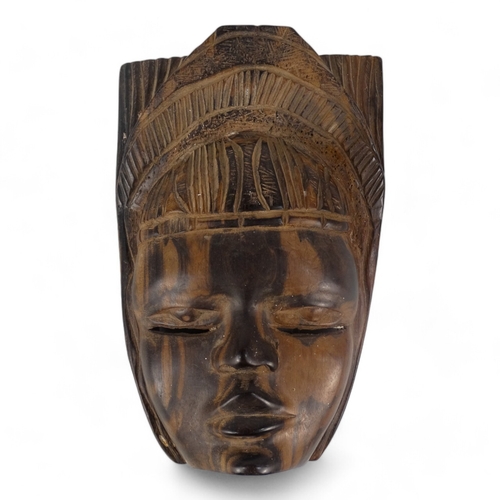 105 - An African hardwood mask - height 28cm, together with an African hardwood figure of a woman, height ... 