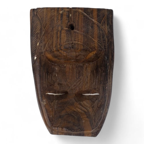 105 - An African hardwood mask - height 28cm, together with an African hardwood figure of a woman, height ... 