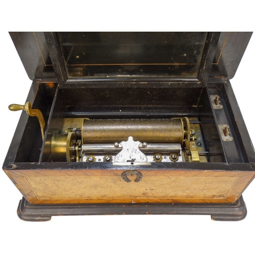 10A - A 19th century Swiss cylinder music box - walnut and amboyna veneered box, the cylinder playing six ... 