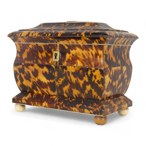 129 - A late George III tortoiseshell tea caddy - of rectangular casket form with a two division interior,... 