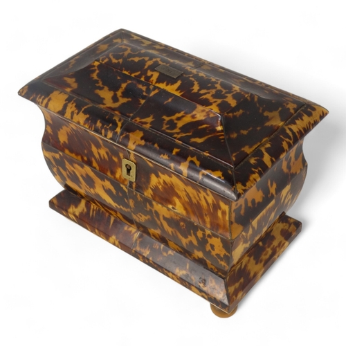 129 - A late George III tortoiseshell tea caddy - of rectangular casket form with a two division interior,... 