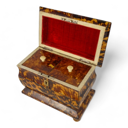 129 - A late George III tortoiseshell tea caddy - of rectangular casket form with a two division interior,... 