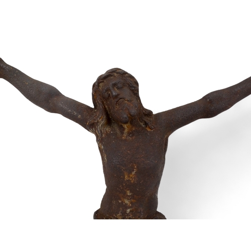 131 - A cast iron figure of Christ on the cross - height 44cm.