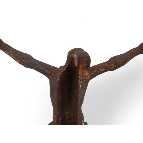 131 - A cast iron figure of Christ on the cross - height 44cm.