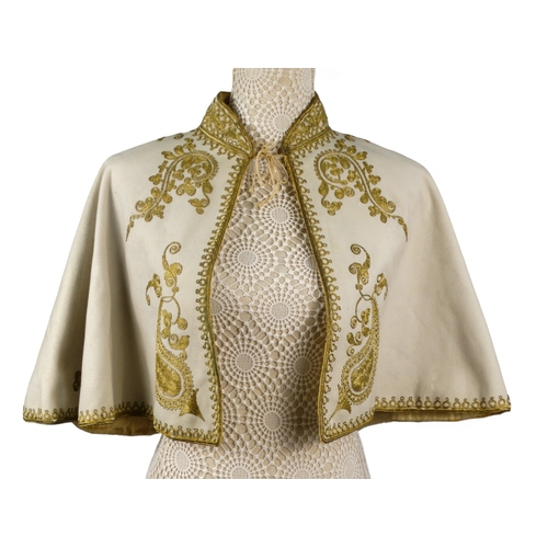 150 - An early 20th century grey wool and gilt embroidered cape - with upstanding collar decorated foliage... 