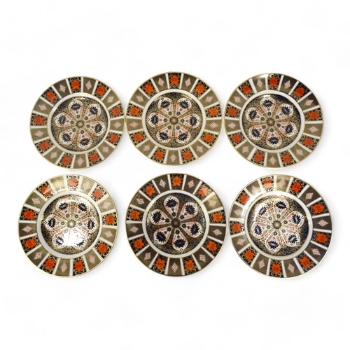 182 - Six Royal Crown Derby plates - decorated in Imari pattern, 27cm diameter. (6)