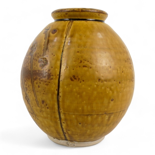 190 - A 20th century pottery vase - modelled as a seed pod, brown glazed, impressed mark to base, 19cm hig... 