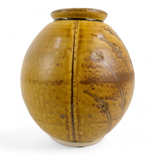 190 - A 20th century pottery vase - modelled as a seed pod, brown glazed, impressed mark to base, 19cm hig... 