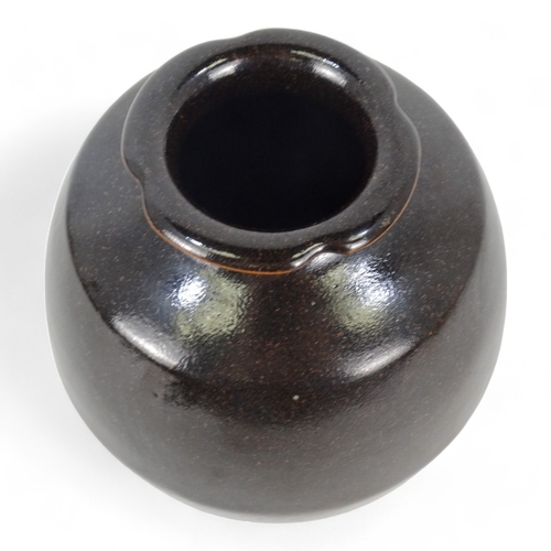 191 - A contemporary pottery vase - brown glazed with faint sgraffito design, 18cm high.