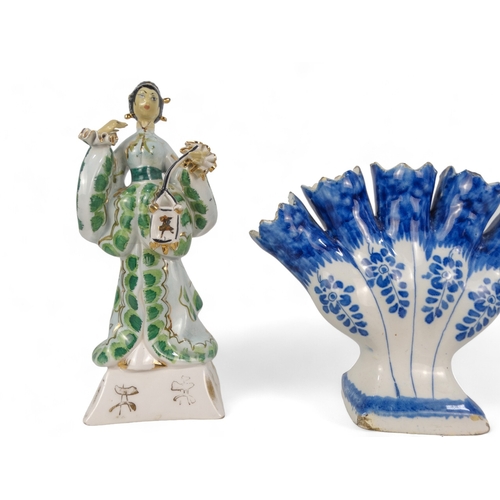 193 - A Delft style tulipiere - decorated with flowers, 15cm high, together with a a polychrome painted ti... 