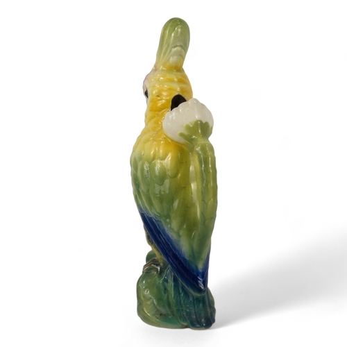 195 - A late 19th century jug - modelled in the form of a cockatoo, 36cm high.