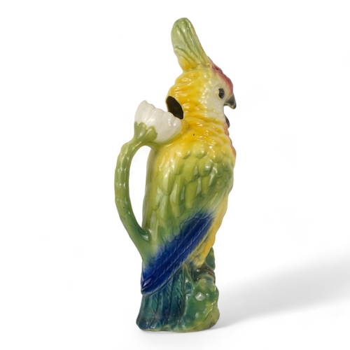 195 - A late 19th century jug - modelled in the form of a cockatoo, 36cm high.