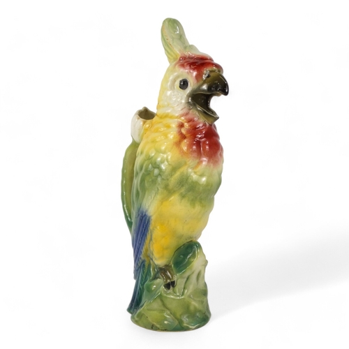 195 - A late 19th century jug - modelled in the form of a cockatoo, 36cm high.