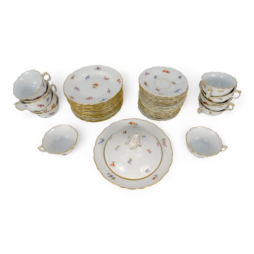 201 - A mid 20th century Meissen tea service - white and decorated with floral sprigs, for twelve place se... 