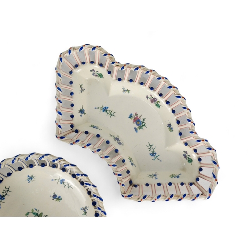 202 - A late 19th century continental hors d'oeuvres dish - basket form creamware and decorated with blue ... 