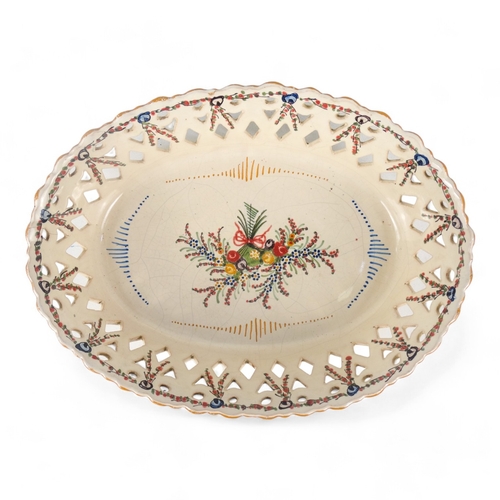 202 - A late 19th century continental hors d'oeuvres dish - basket form creamware and decorated with blue ... 