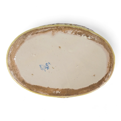 202 - A late 19th century continental hors d'oeuvres dish - basket form creamware and decorated with blue ... 