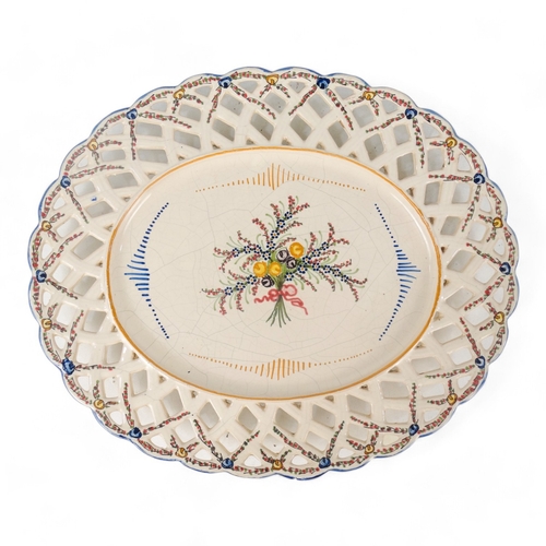 202 - A late 19th century continental hors d'oeuvres dish - basket form creamware and decorated with blue ... 