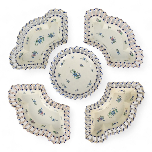 202 - A late 19th century continental hors d'oeuvres dish - basket form creamware and decorated with blue ... 