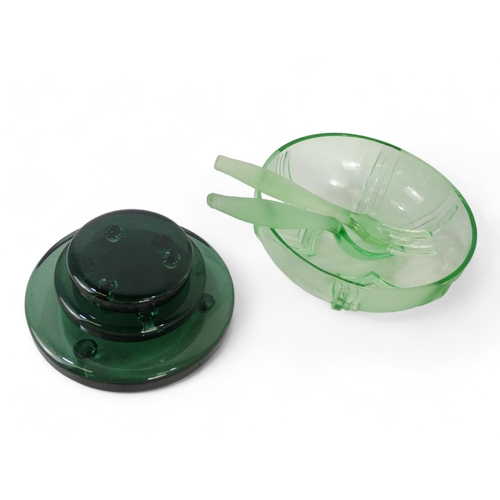 208 - An Art Deco green glass bowl and salad servers - together with a set of three graduated green glass ... 