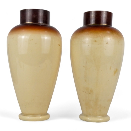 212 - A pair of Aesthetic Movement glass vases - decorated with flowers and butterflies, height 32cm.