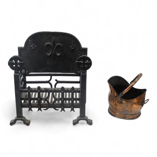 25 - A rectangular fire grate - with an openwork basket and a cast iron fire back decorated with a fleur ... 